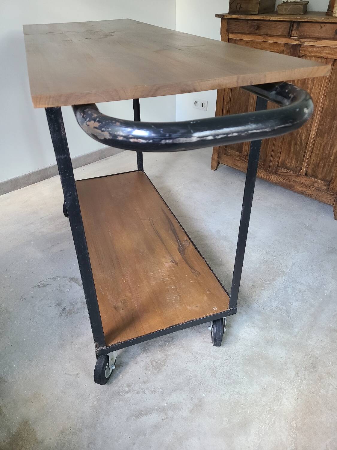 Large central kitchen island trolley on wheels serving industrial console