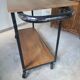 Large central kitchen island trolley on wheels serving industrial console