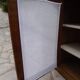 Antique wooden sideboard, fabric doors and pearl grey shelves.