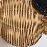 Wall composition of wicker baskets and trays.