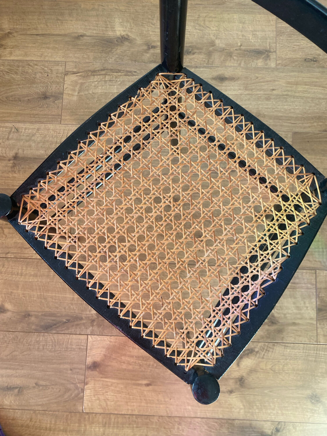 Light wooden chair with caning