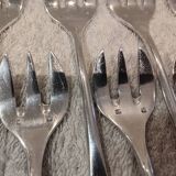 12 silver-plated oyster forks by silversmith J Brille with stick handles.