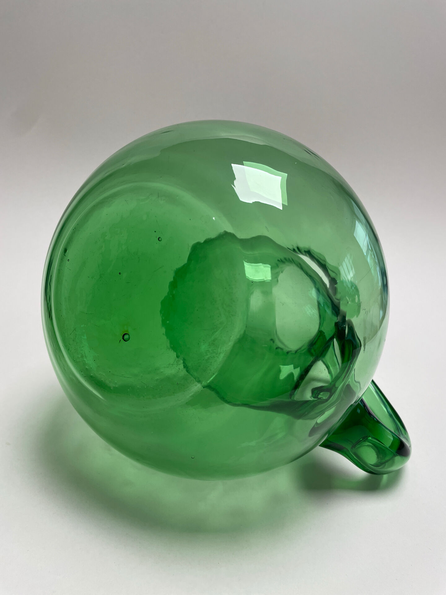 Large green glass cooling jug