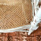 19th-century corner fireplace armchair, wood and cane.