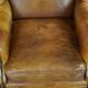 Wingback chair made of sheepskin leather in a light honey color