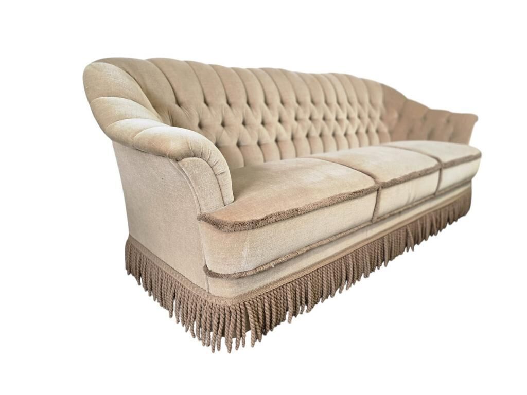 Canapé vintage beige avec franges