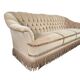Canapé vintage beige avec franges
