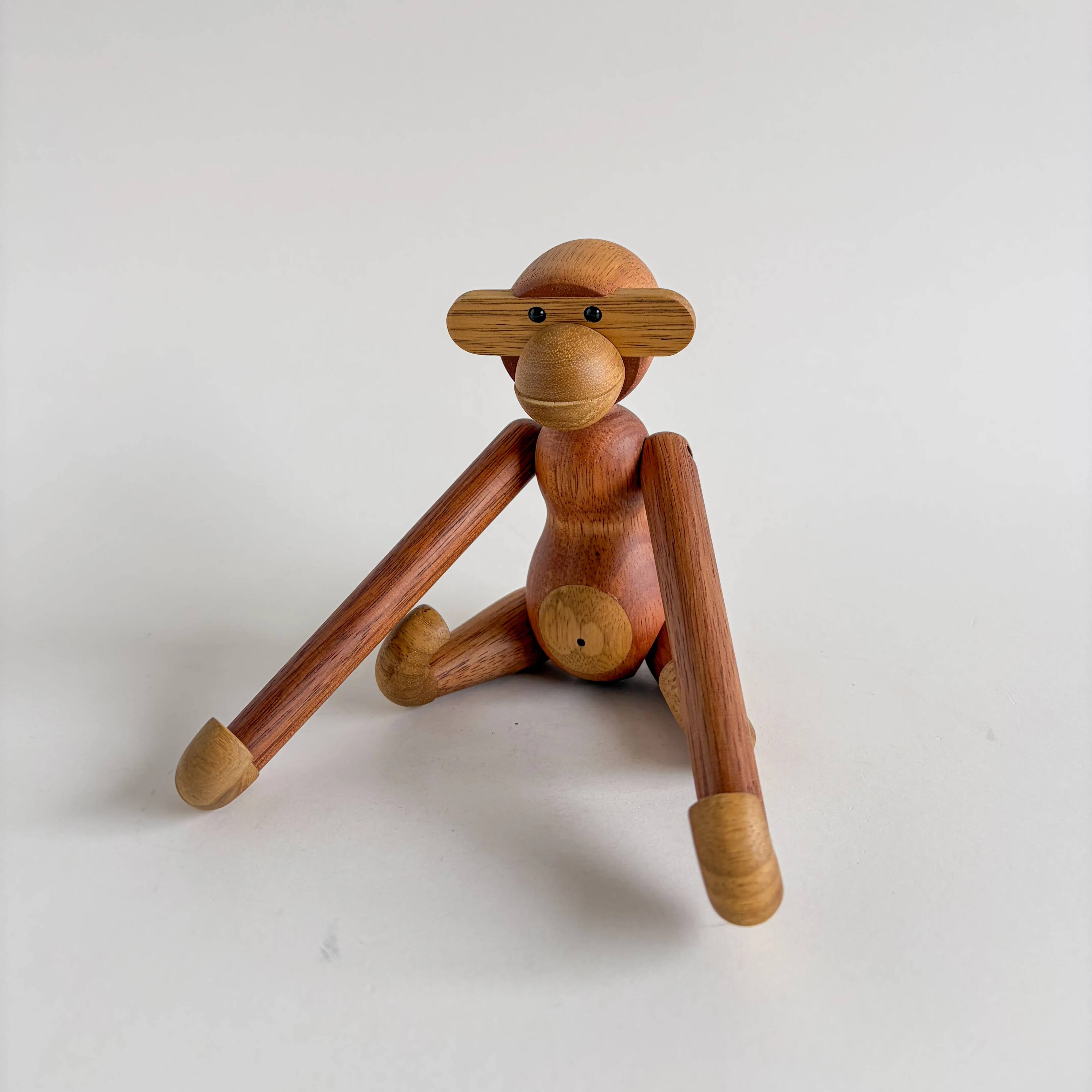 Teak monkey figurine