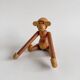 Teak monkey figurine