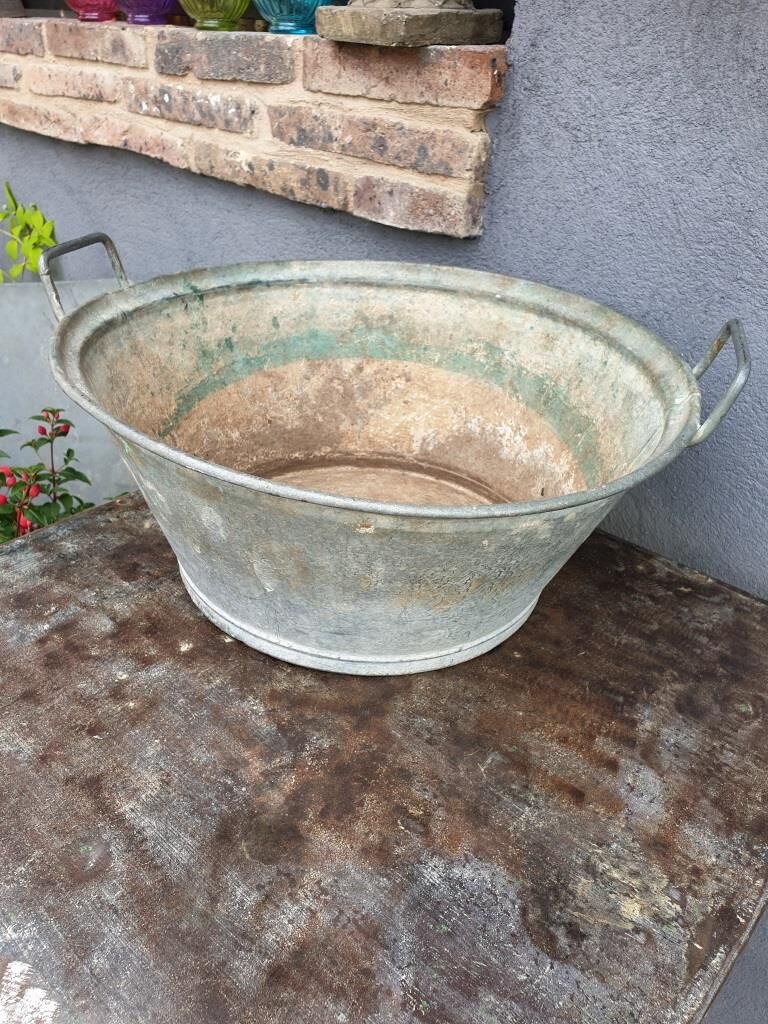 Old zinc basin with handles