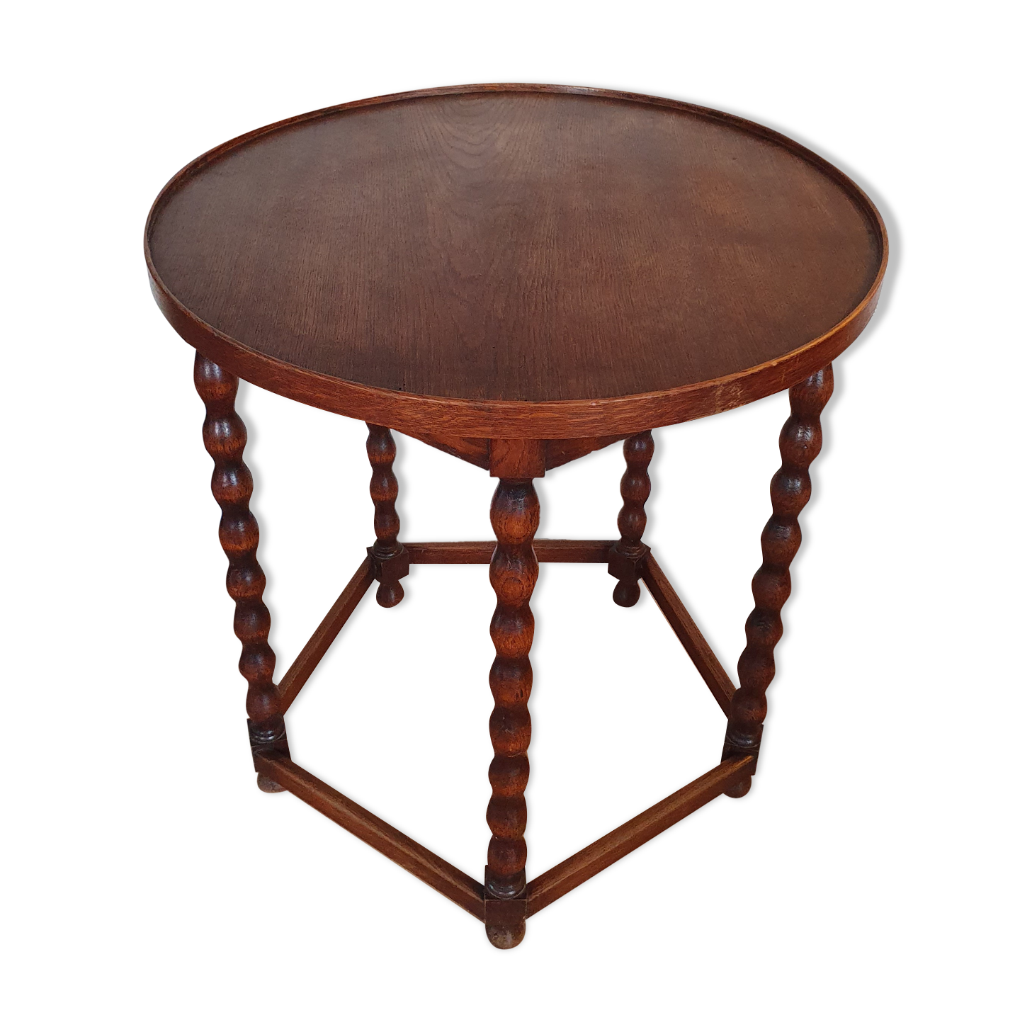 Round wooden table with beaded legs