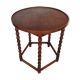 Round wooden table with beaded legs