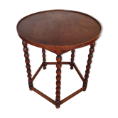 Round wooden table with beaded legs