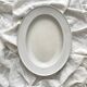 Vintage marbled white and blue enameled sheet metal oval dish