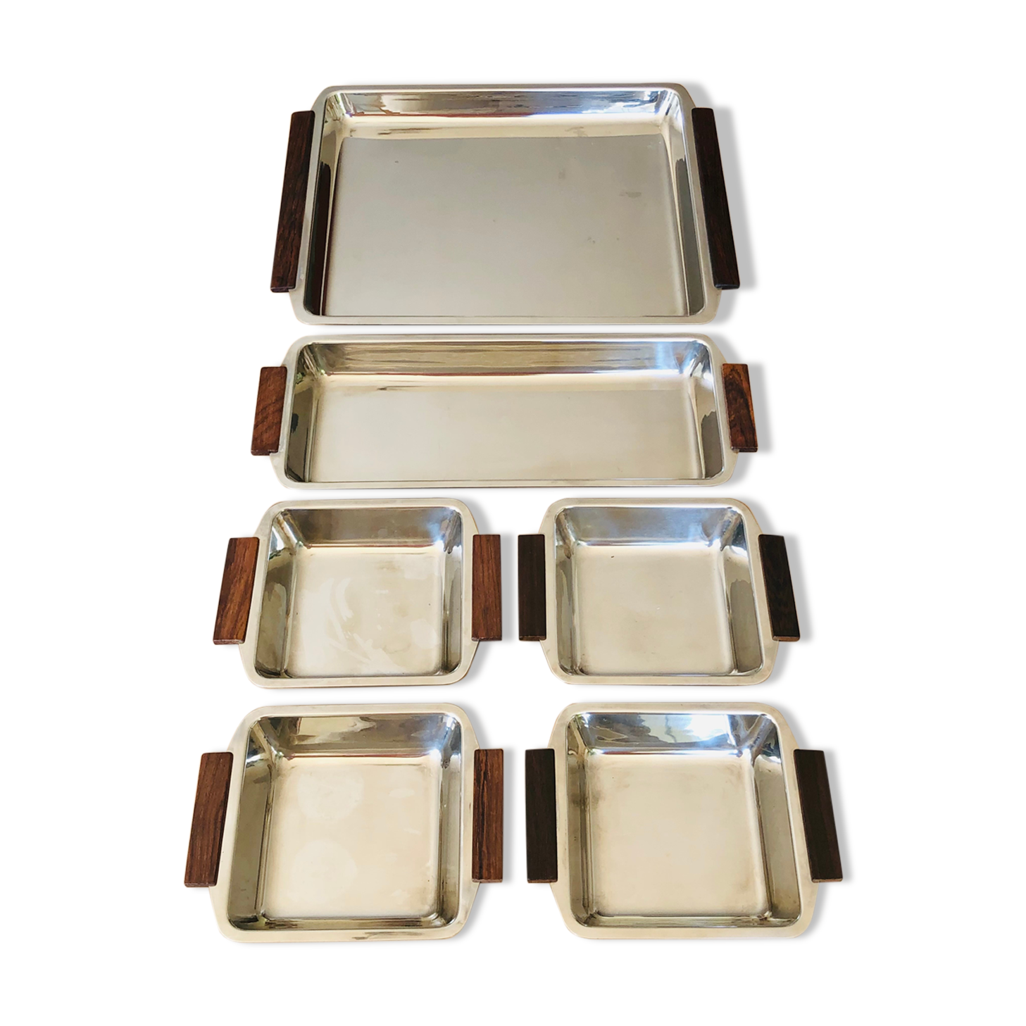 Service of Scandinavian dishes in stainless steel and teak 1970