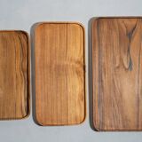 Trio of rounded rectangular trays or cups in monoxyl teak L:35