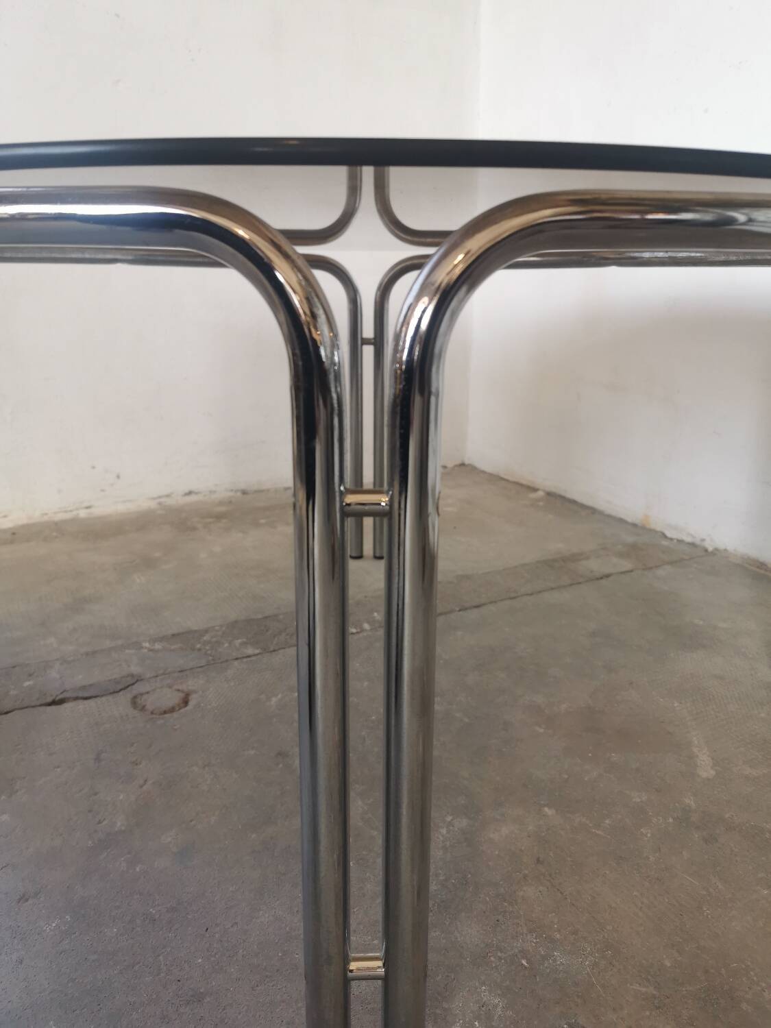 Round chrome and smoked glass coffee table