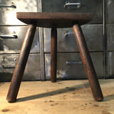 Wooden milking stool on tripod base