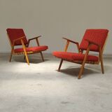 Pair of armchairs in mottled red and wood by Uluv, former Czechoslovakia 1960