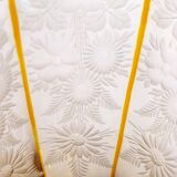 Art Deco vase engraved with flowers, faceted body on a pedestal.