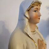 Religious statuette of the Virgin Mary in bisque porcelain