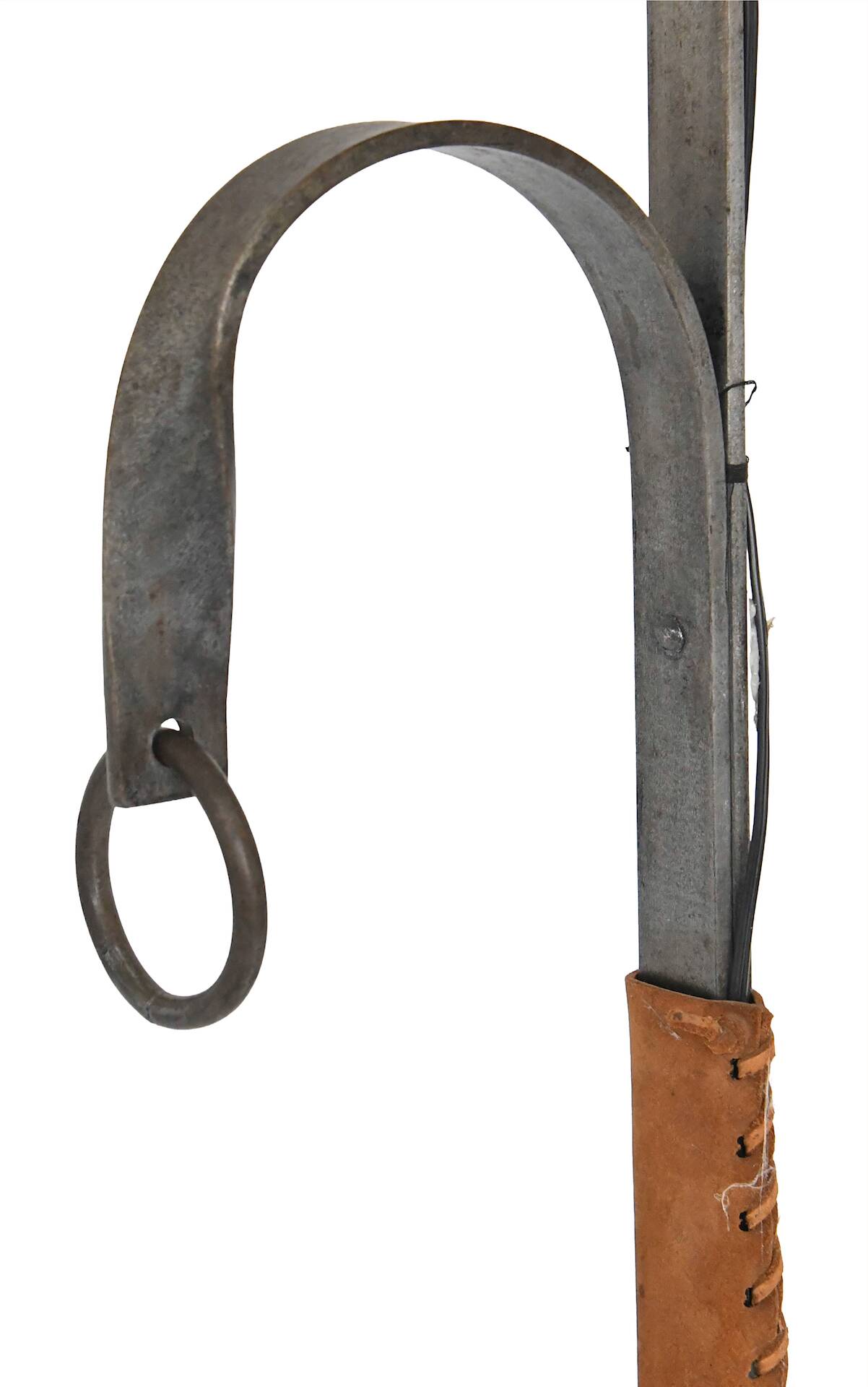 Wrought iron and leather floor lamp in the style of Jean-Pierre Ryckaert.