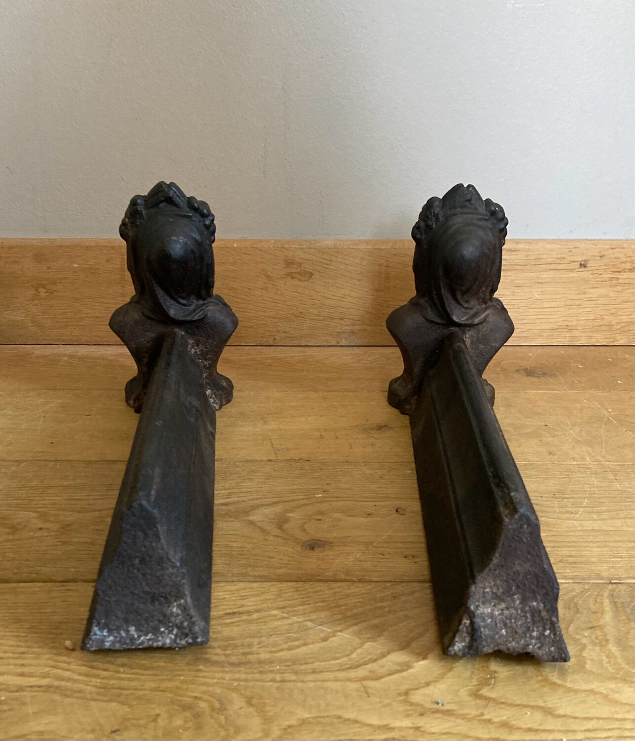 Pair of cast iron andirons from the 19th century, busts of women