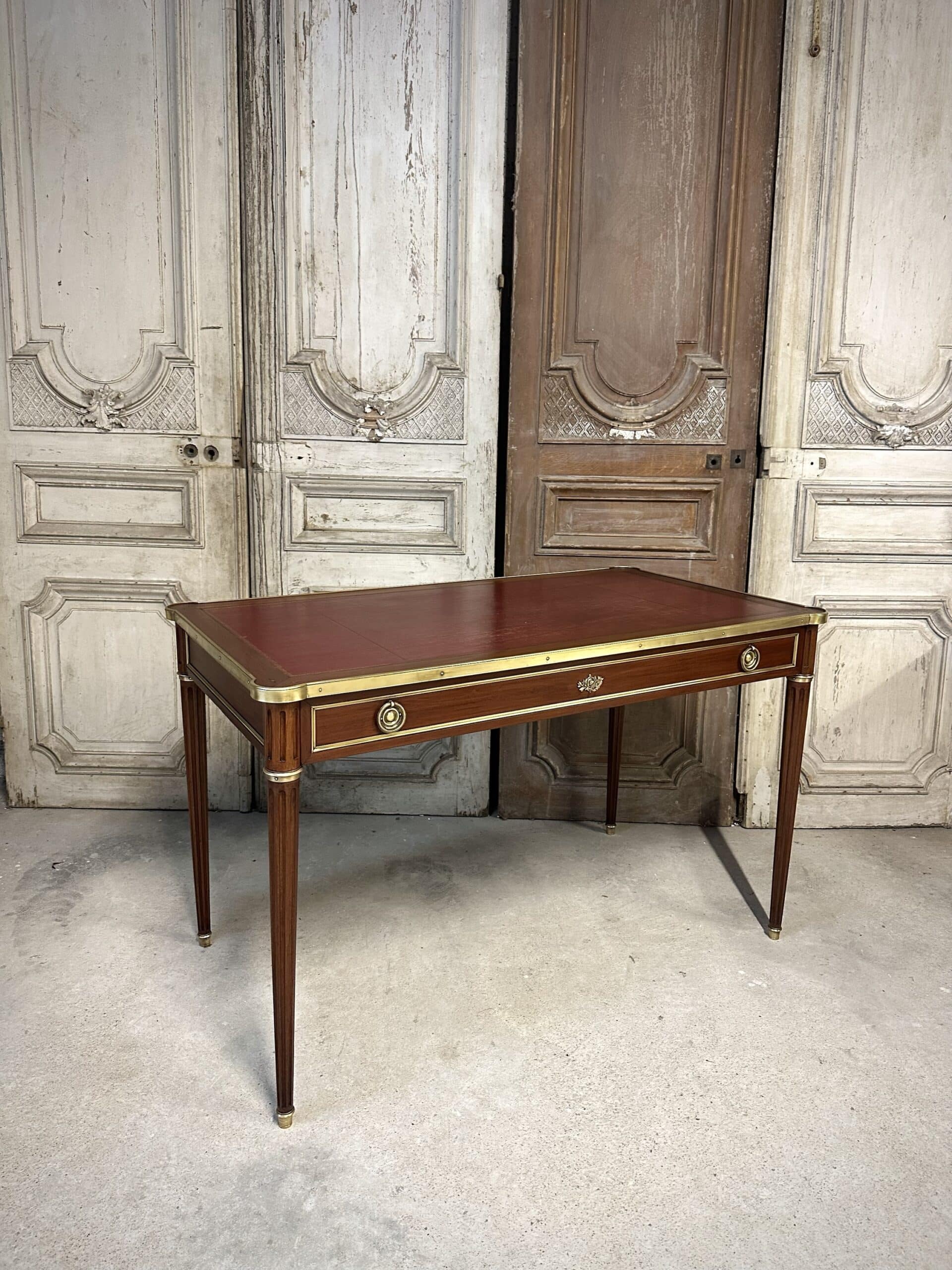 Louis XVI style flat desk in mahogany from around 1950.