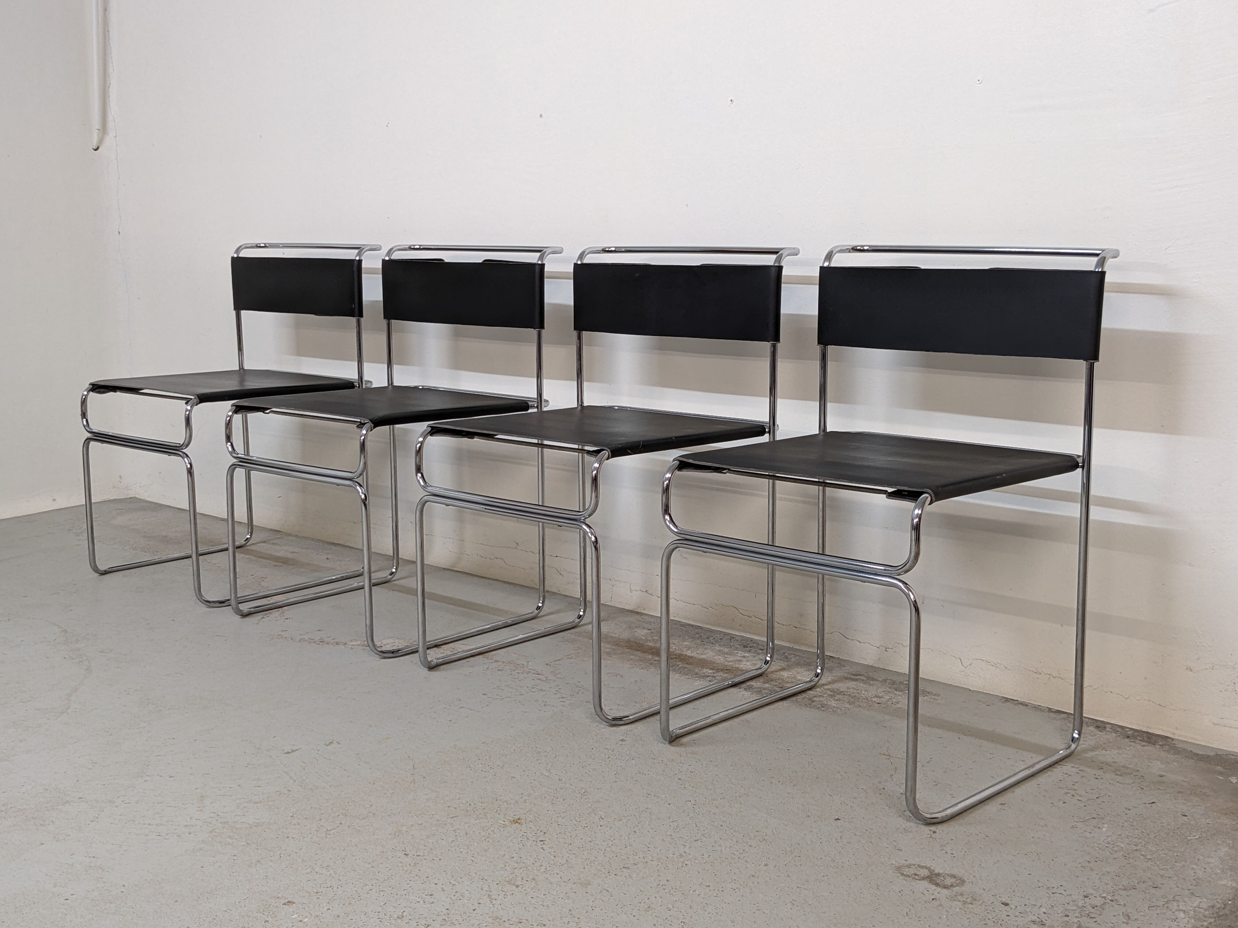 Suite of 4 chairs in chromed metal and leather by Giovanni Carini for Planula - 70s