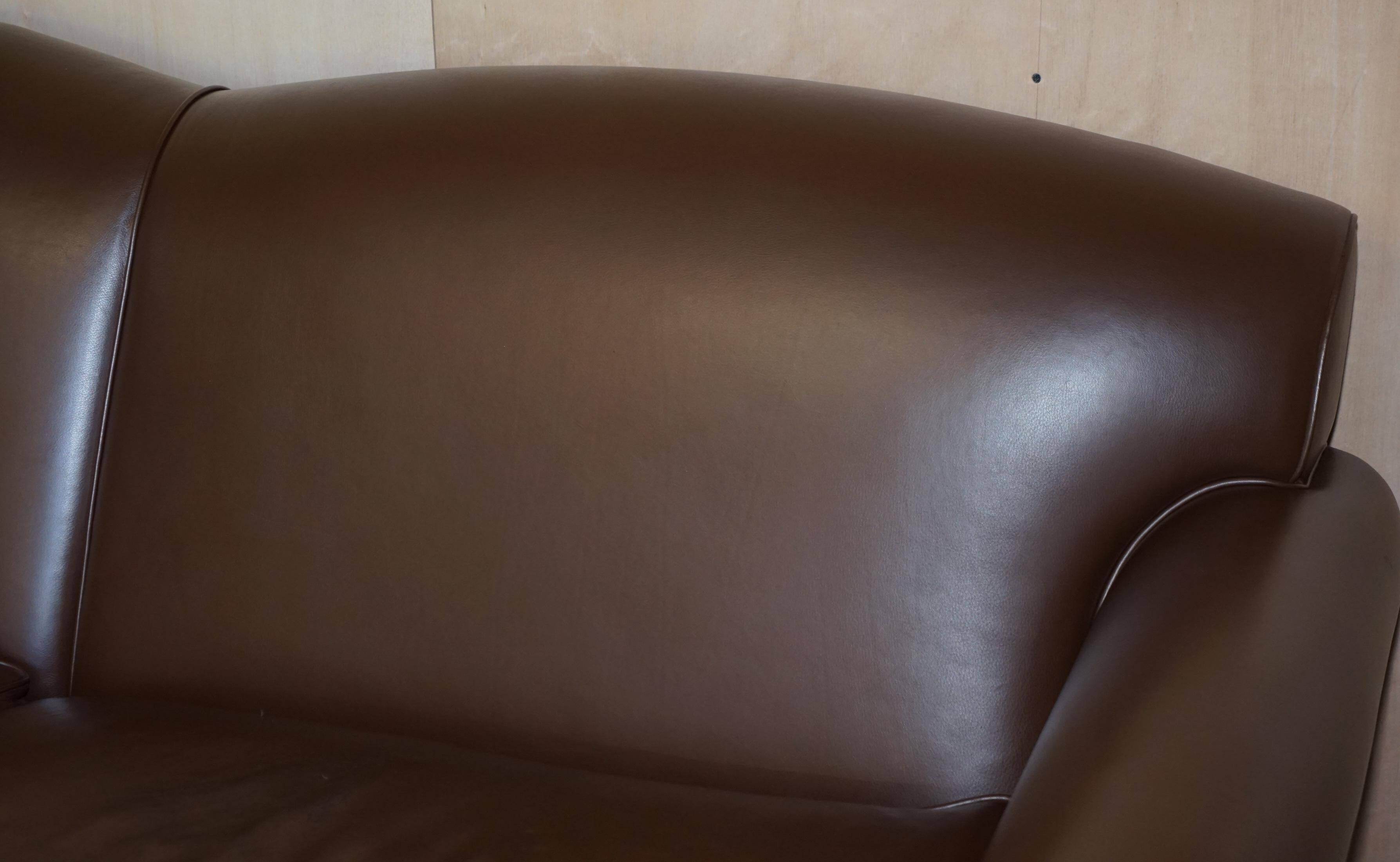 Contemporary Howard & Sons style grand sofa with brass casters.