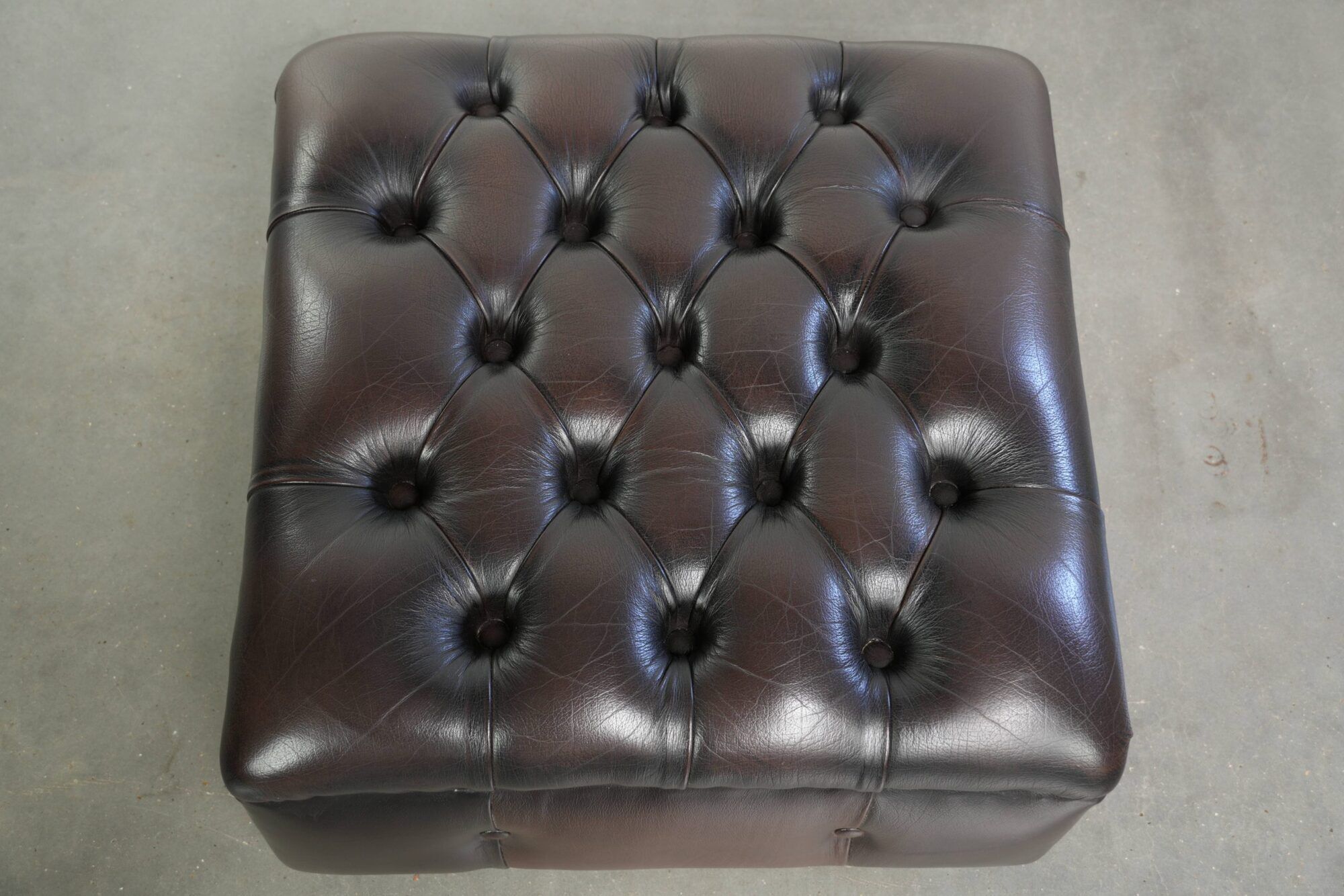 Cowhide Chesterfield ottoman with beautiful colours in English style