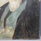 Old portrait of man painted on wooden panel
