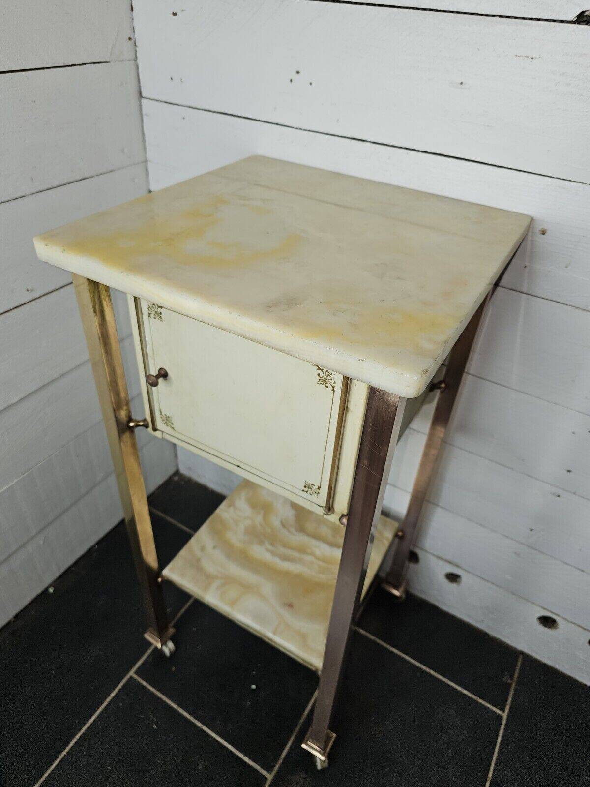 Bedside table in patinated iron, brass and marble tops