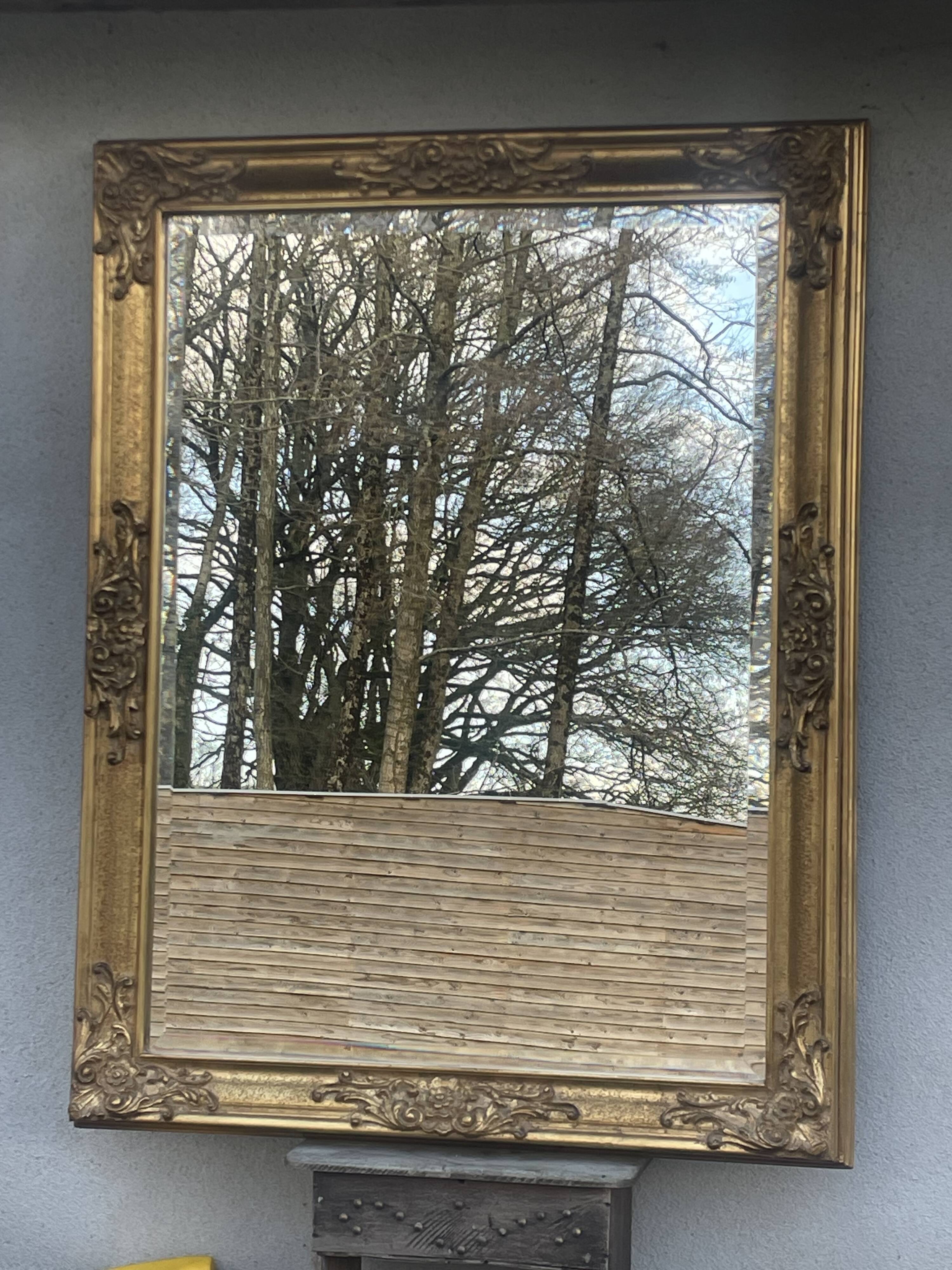 vintage bevelled mirror in rectangular shape, stucco and gilded wood in Louis XV baroque style
