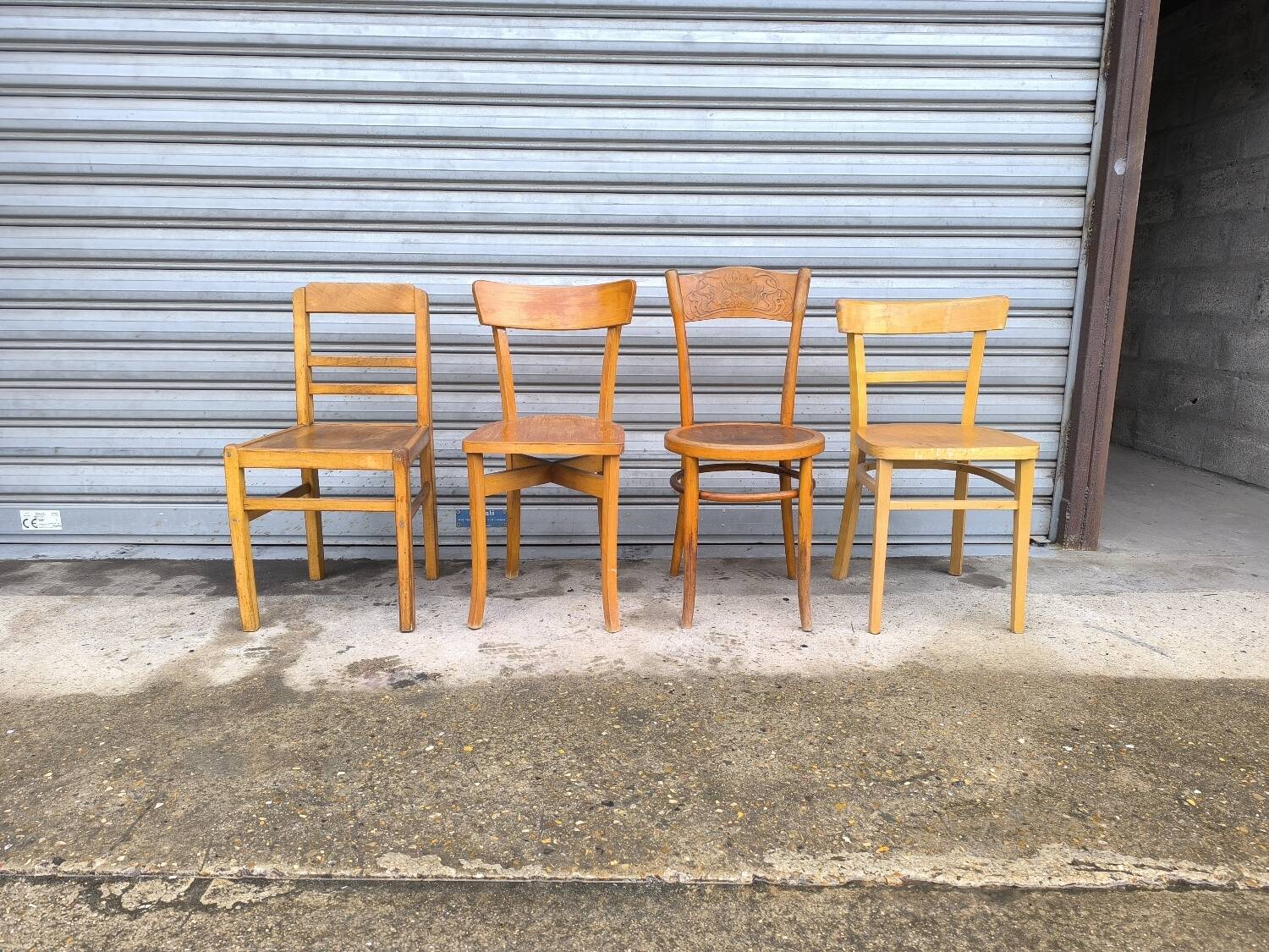 Set of four mismatched bistro chairs