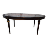 Oval Louis XVI style table with half-moon extensions.