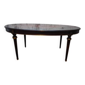Oval Louis XVI style table with half-moon extensions.