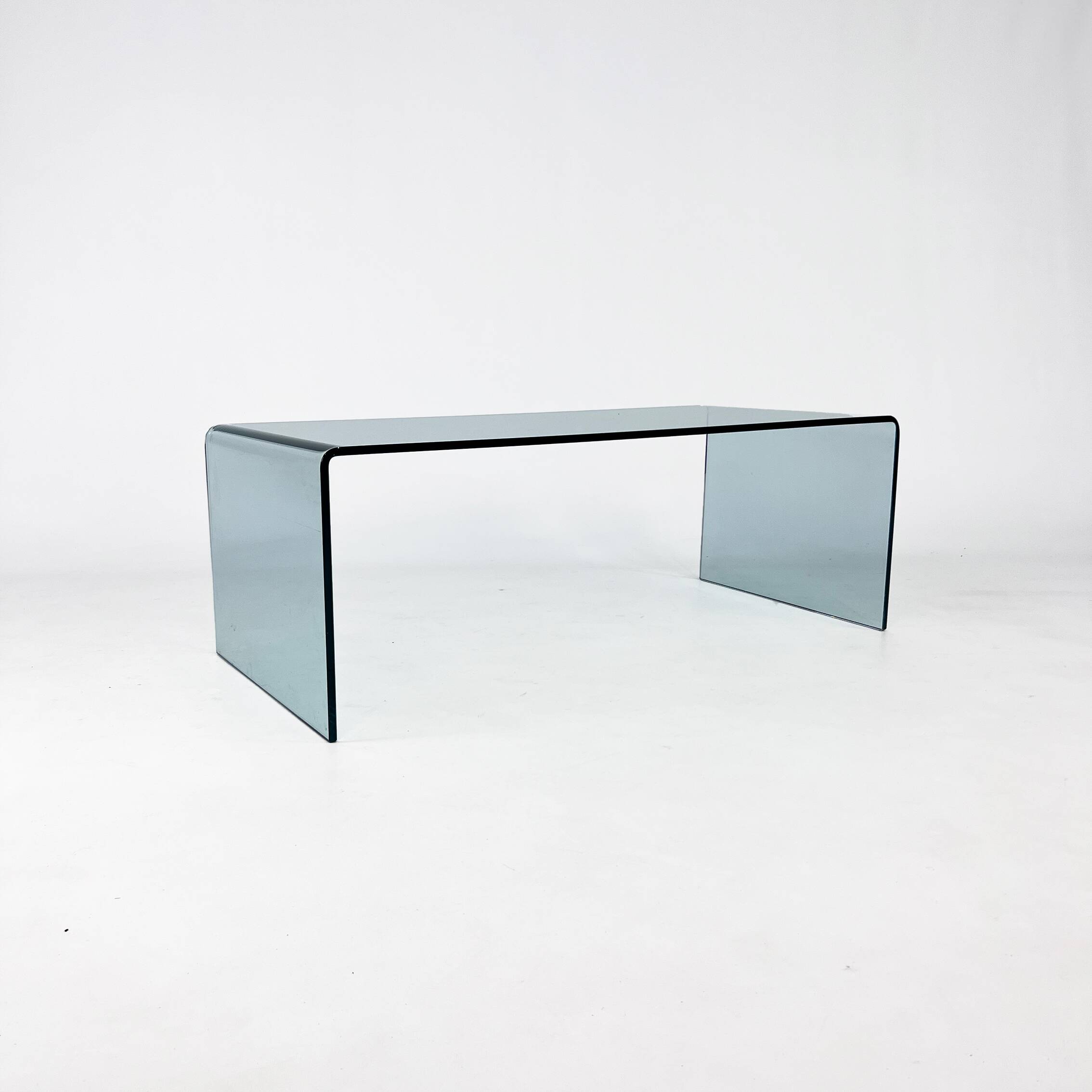 Postmodern coffee table made entirely of glass. Modernist and bitches minimalist look.