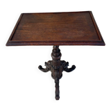 Tripod pedestal table in solid oak, richly carved and molded, 19th century