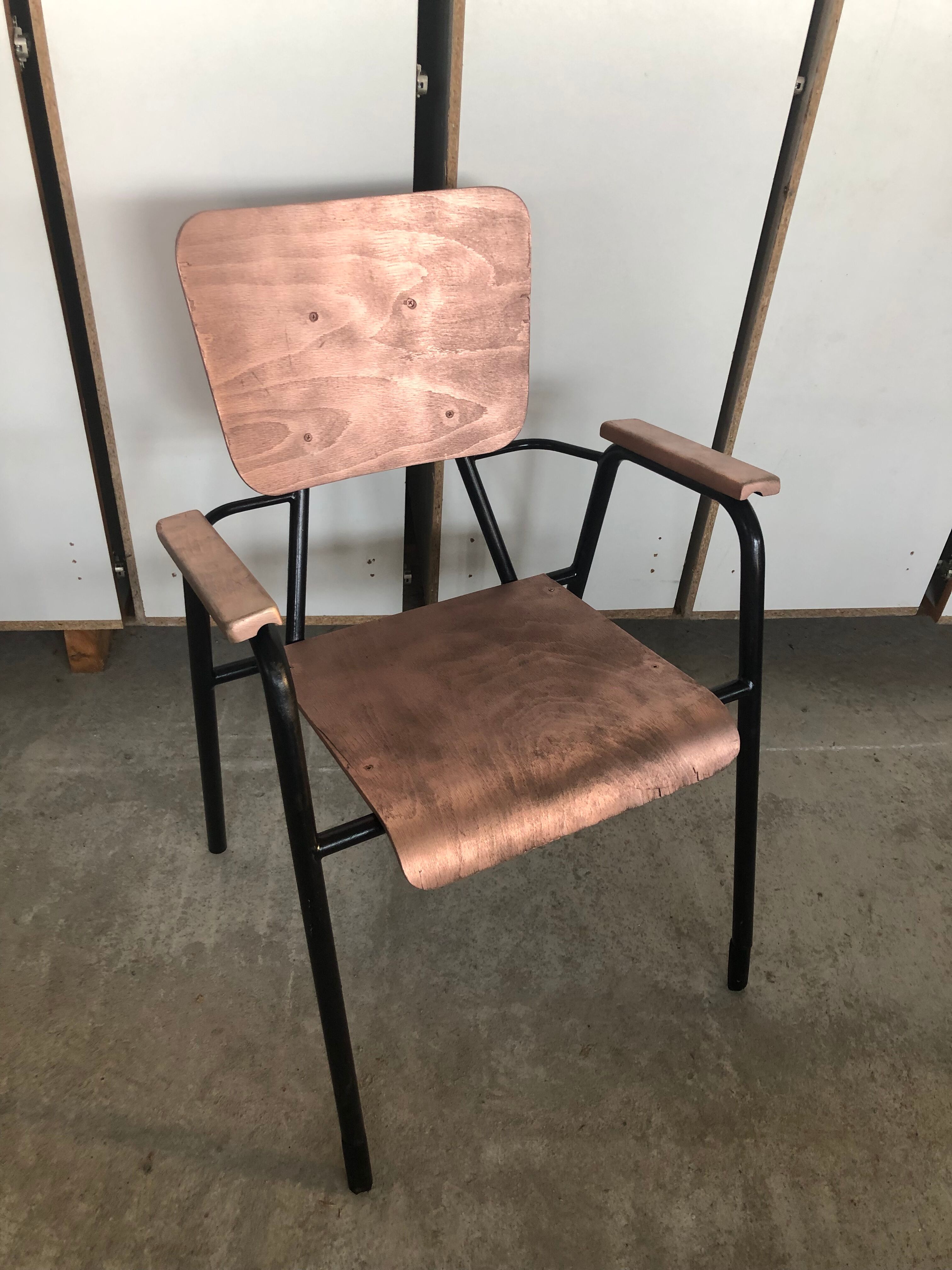 Old chair with armrest restored in metallic pink