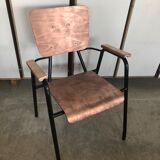 Old chair with armrest restored in metallic pink
