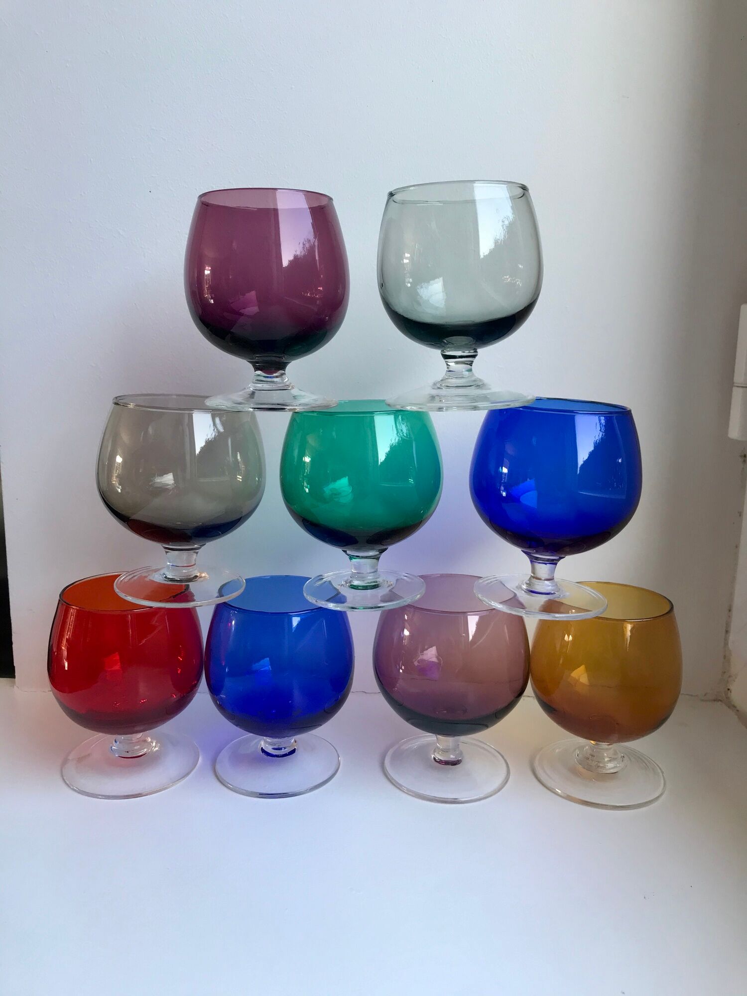 Set of 9 glasses with colored feet in blown glass 50s