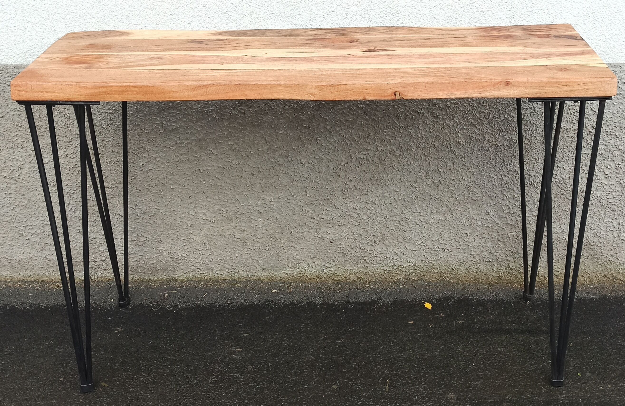 Wooden console with black metal legs