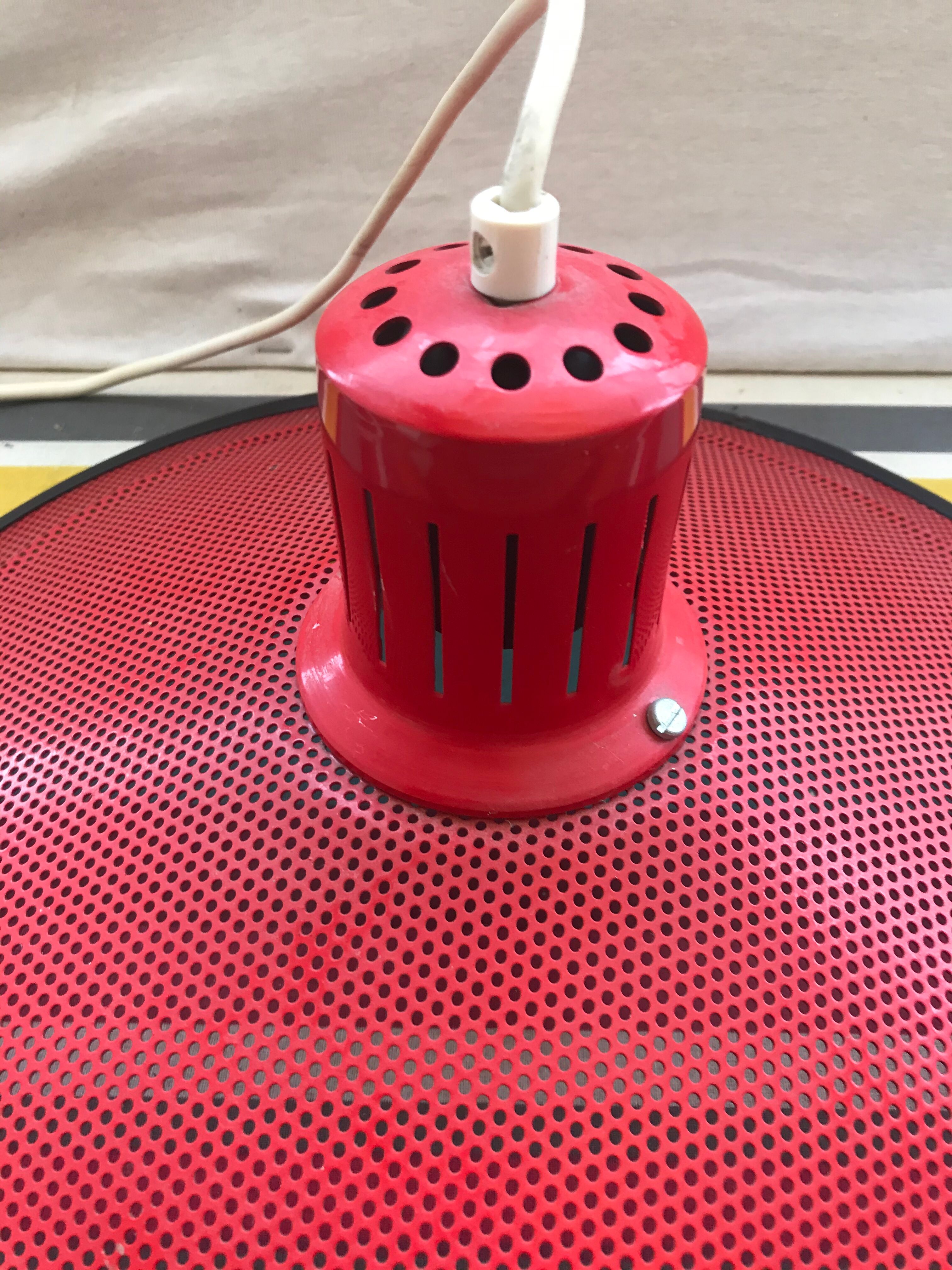 Old design metal perforated suspension in red