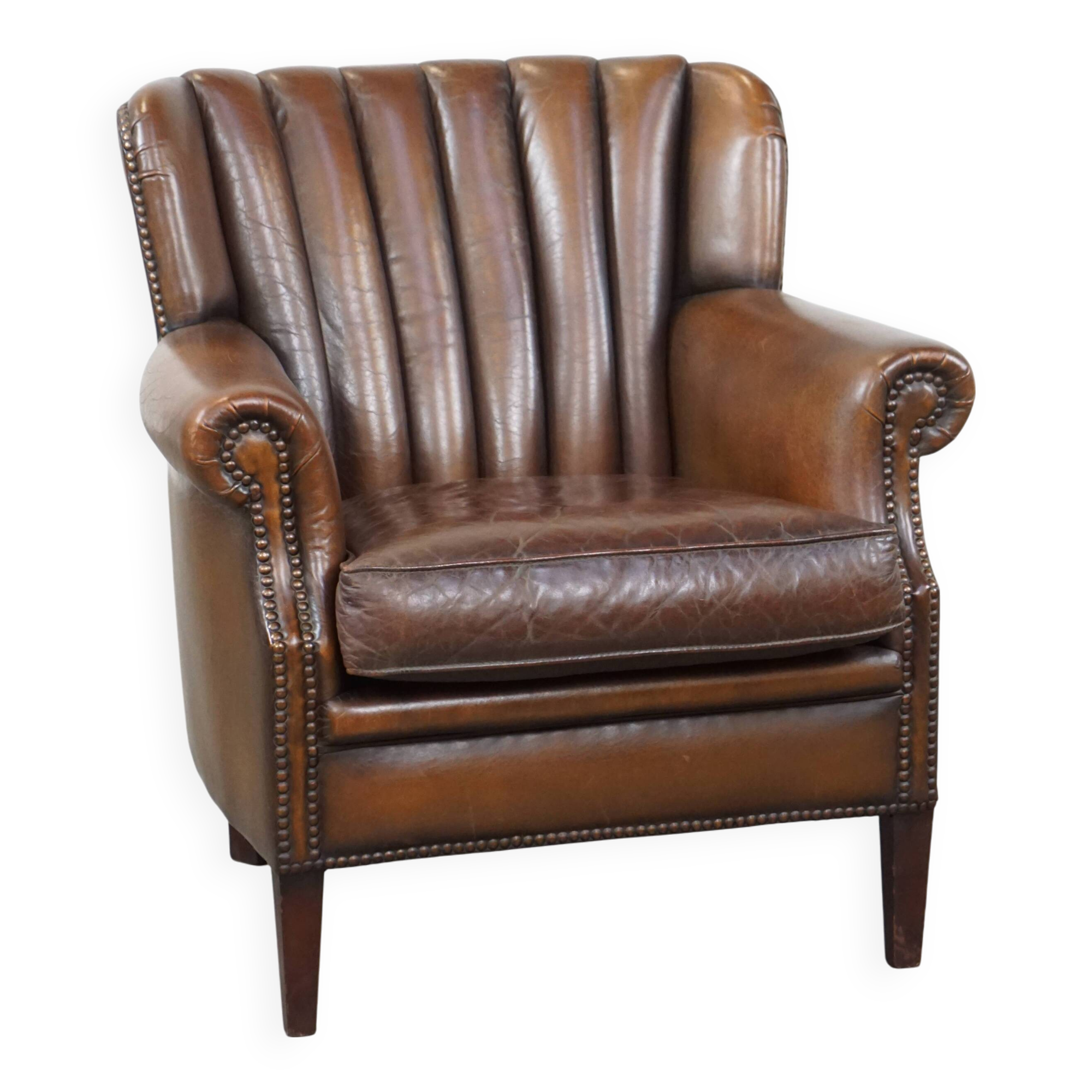 Sheep leather armchair finished with decorative nails
