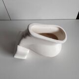 Atypical ashtray in the shape of a toilet