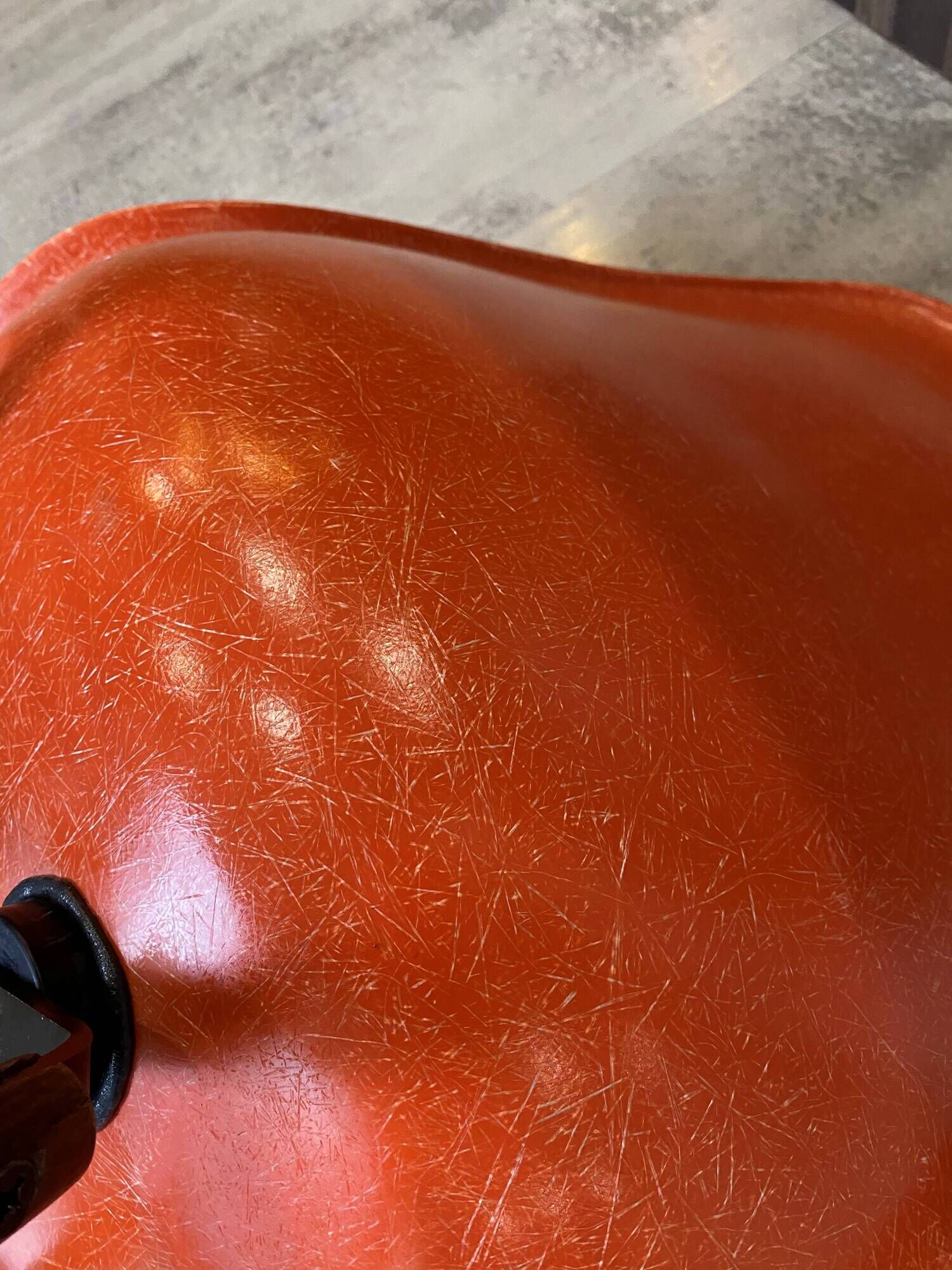 A vintage 70s Eames Herman Miller DSW Fiber Red Orange Dowel Walnut Chair