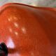 A vintage 70s Eames Herman Miller DSW Fiber Red Orange Dowel Walnut Chair