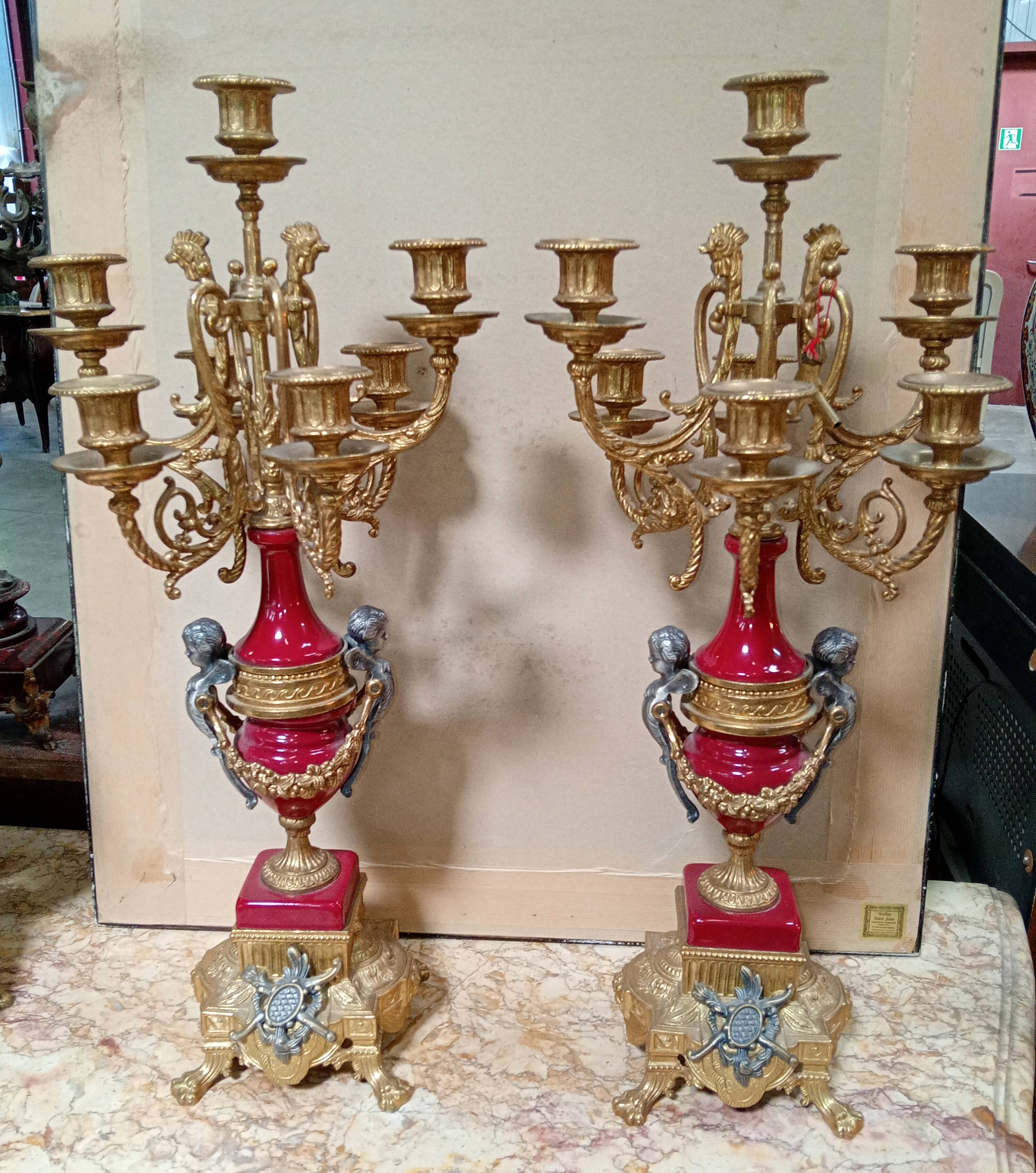 Pair of six-light candelabra in patinated and gilded bronze and spelter.
