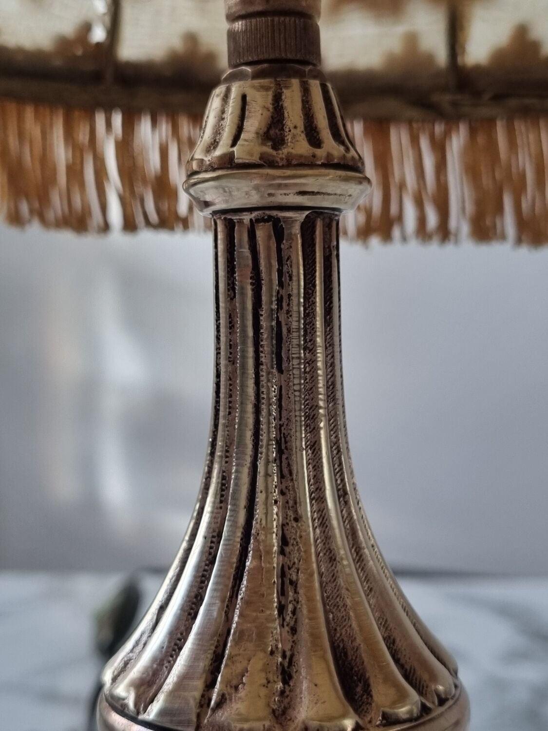 Brass lamp with vintage mother-of-pearl lampshade